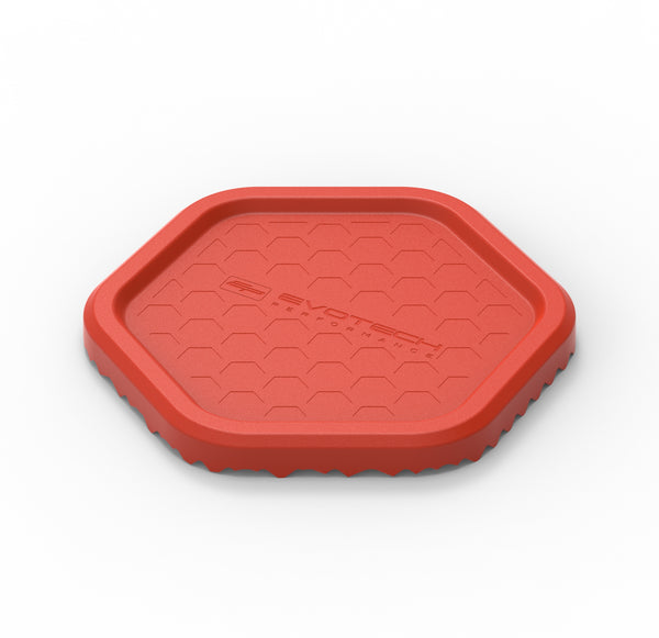 Produced from injection-moulded plastic in vibrant red, the Evotech Side Stand / Puck is an easy to spot motorcycle accessory. Finished with a hegagonal indentation pattern on the upper side, with Evotech Performance logo, the EP motorcycle parking support has a pyramid texture on the lower side for added grip/