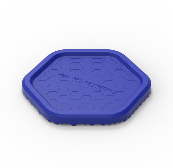 Evotech's blue Side Stand Puck is hexagonal shape with an indented hexagonal pattern and Evotech Performance logo to the upper side. The motorcycle accessory has a textured lower side for easy grip to a range of terrains.