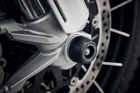 The precision fit of the EP Spindle Bobbins Crash Protection Kit to the front wheel of the Ducati DesertX.