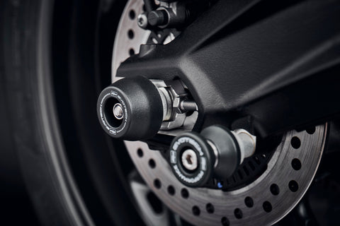 The rear wheel and swingarm of the Triumph Street Triple RS with EP Rear Spindle Bobbins installed to give Evotech Performance’s crash protection to the motorcycle’s rear end. 