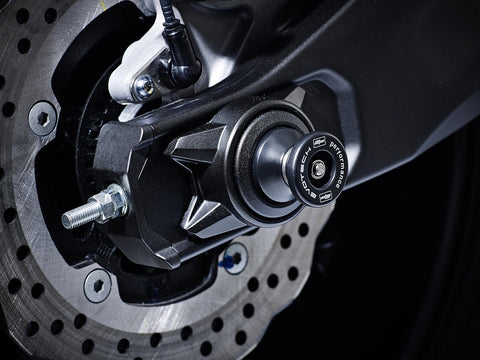 The hourglass shaped paddock stand bobbin from EP Spindle Bobbins Paddock Kit fitted to the rear wheel of the Yamaha MT-07 Moto Cage.