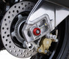 The exhaust side rear wheel of the Aprilia Tuono V4 Factory with EP’s attractive red anodised hub stop fitted.