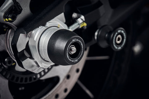 The rear swingarm of the Ducati DesertX with an EP black nylon spindle bobbin securely fitted, protecting the swingarm and fitted near EP Paddock Stand Bobbins.