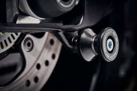 The rear wheel of the Suzuki GSX-S1000Y with EP Paddock Stand Bobbins installed.