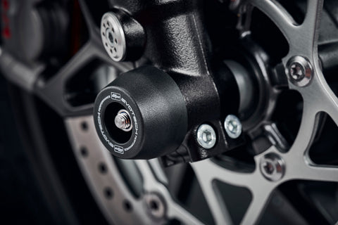 The front fork of the Triumph Street Triple 765 RS fitted with Evotech Performance’s signature crash slider from EP Front spindle Bobbins, protecting the forks and brake calipers.