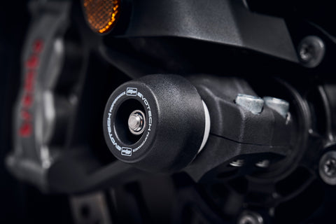 The nylon crash protection bung from EP Front Spindle Bobbins extends from the front wheel of the Triumph Tiger 1200 GT Pro, safeguarding the lower front forks and brake calipers.