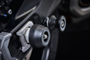 The rear wheel and swingarm of the Triumph Tiger Sport 660 with EP Rear Spindle Bobbins installed to give Evotech Performance’s crash protection to the motorcycle’s rear end. 
