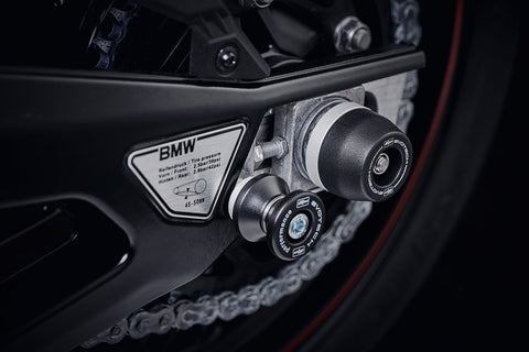 The nearside of the rear wheel of the BMW S 1000 RR HP4 with EP Spindle Bobbins Crash Protection attached, guarding the swingarm and chain.