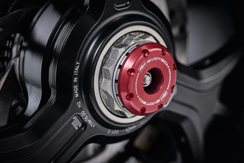 The striking anodised red hub stop from the EP Spindle Bobbins Crash Protection Kit fitted to the offside rear wheel of the Ducati Multistrada 1200 S Granturismo.