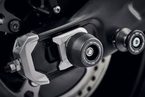 The rear wheel and swingarm of the Triumph Trident with EP Rear Spindle Bobbins installed to give Evotech Performance’s crash protection to the motorcycle’s rear end. 