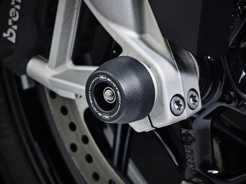 An EP spindle bobbin from EP Spindle Bobbins Kit seamlessly fitted to the front wheel of the BMW S 1000 XR Sport SE, protecting the front fork and brake calipers.