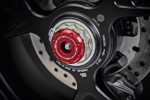 The anodised red hub stop of the EP Rear Spindle Bobbins Crash Protection fitted to the offside rear wheel of the Ducati Streetfighter V4 SP2.