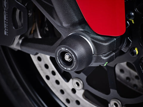 The front wheel of the Ducati Scrambler Desert Sled with EP Front Spindle Bobbins crash protection fitted, one half of the EP Spindle Bobbins Paddock Kit. 