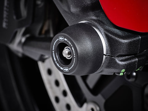 The front wheel of the Ducati Scrambler Flat Tracker Pro featuring EP Front Spindle Bobbins crash protection, one half of the EP Spindle Bobbins Paddock Kit. 