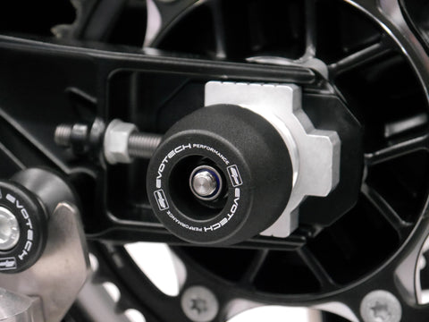The rear wheel of the KTM 790 Adventure with EP Spindle Bobbins Crash Protection bobbin fitted to the rear spindle offering swingarm protection.