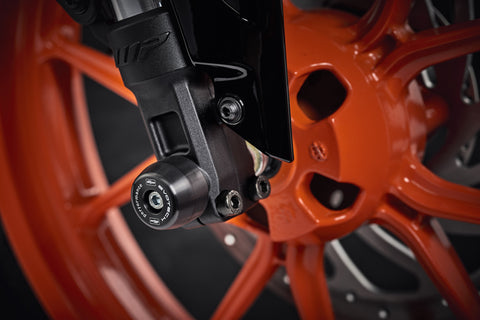 The lower front fork of the KTM RC 200 with EP Front Spindle Bobbins securely attached, offering crash protection to the motorcycle’s front wheel.