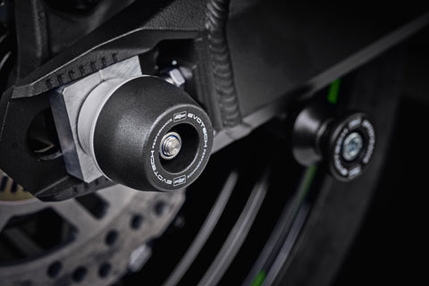The rear wheel of the Kawasaki Z900RS Cafe with EP Spindle Bobbins Crash Protection bobbin mounted to the rear spindle offering swingarm protection. 