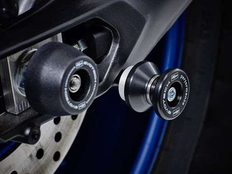 The swingarm of the Yamaha Tracer 900 GT with EP Paddock Stand Bobbins installed near EP Rear Spindle Bobbins Crash Protection. 