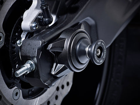 The hourglass shaped paddock stand bobbin from EP Spindle Bobbins Paddock Kit fitted to the rear wheel of the Yamaha YZF-R7.