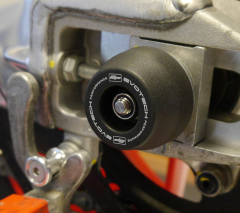 The swingarm of the Aprilia Tuono V4 with nylon EP Spindle Bobbin attached to the wheel spindle.